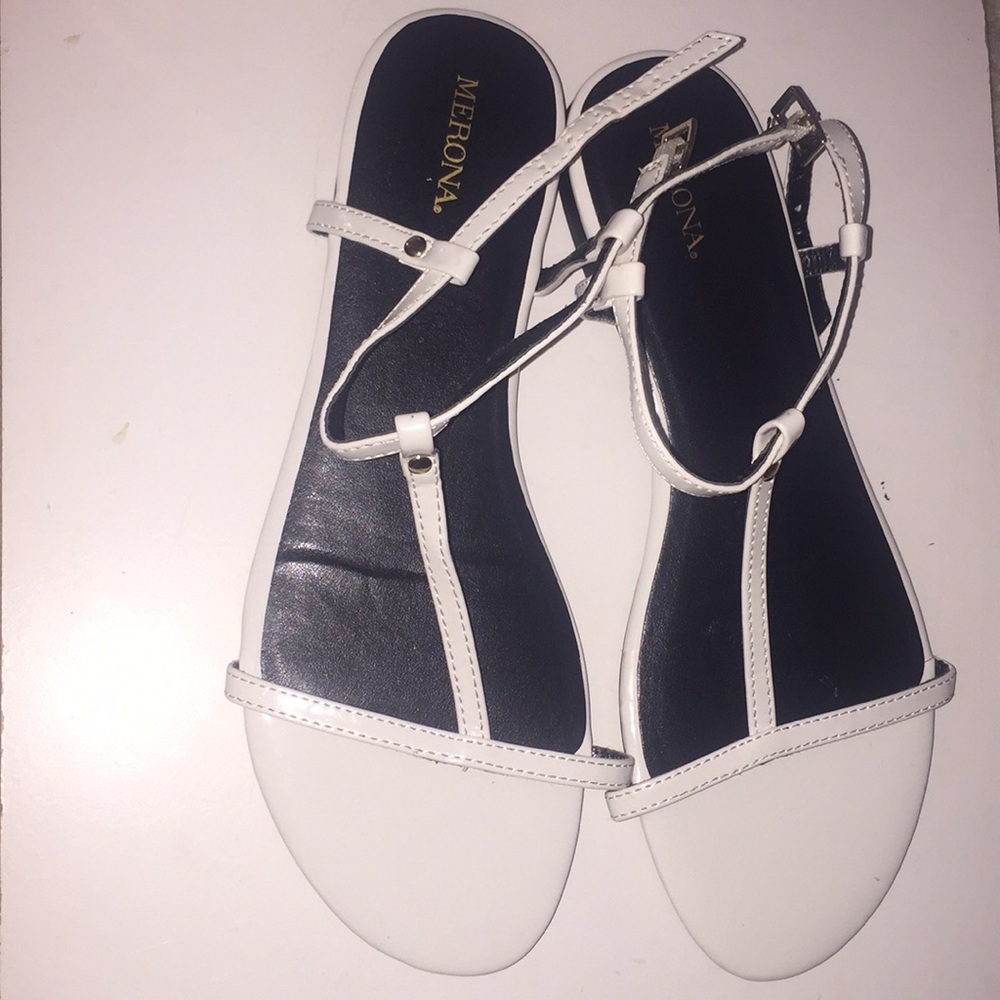 white sandals with gold detailing